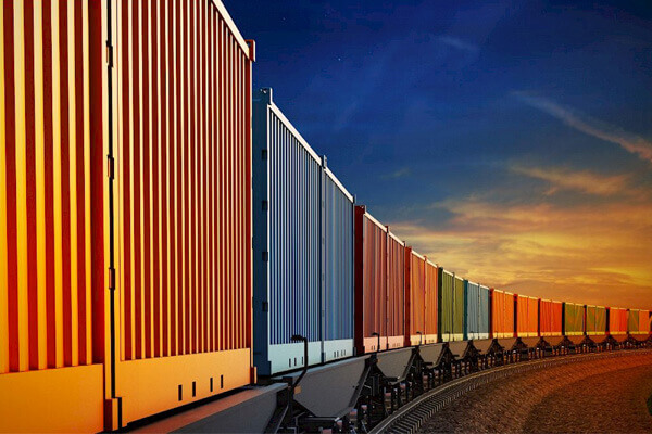 Our Services Include RAIL FREIGHT Forwarding on track showing 14 containers at dusk clear crisp photo