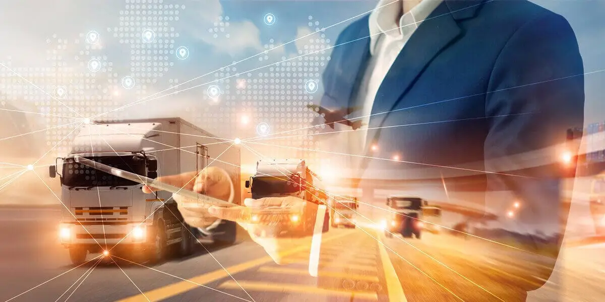 Road Freight Solutions At Sarr Logistics UK man in suite with logistics backdrop of lorries and planes