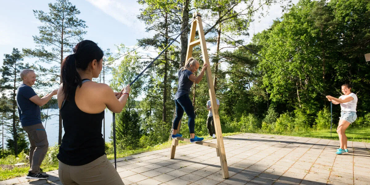 men and women teambuilding exercise to enhance moral Who We Are