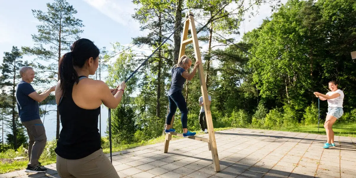 men and women teambuilding exercise to enhance moral Who We Are
