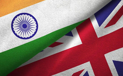 UK and India flags representing the historic trade deal benefits for freight forwarding and logistics companies in 2025.